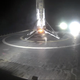 The recovered Falcon 9 rocket stage rests on a sea-going drone landing platform.